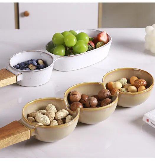 Plato de cerámica creativo para frutos secos y aperitivos de estilo europeo con mango de madera
