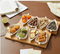 4 cuencos de cerámica para aperitivos con bandeja de bambú.