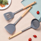 Utensilios de cocina a prueba de calor del silicón de la categoría alimenticia que fríen la pala de cocinar con la manija de madera