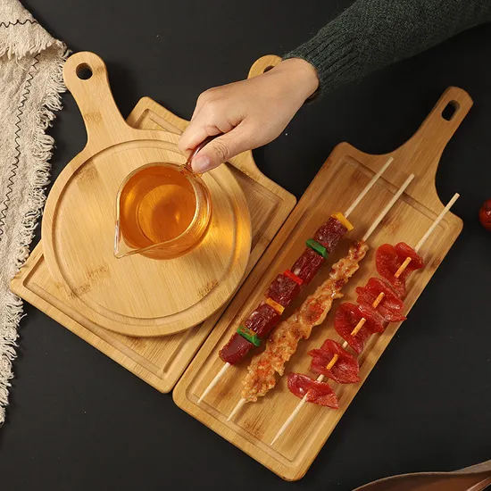 Tabla redonda sostenible de bambú para servir frutas, pan y queso con asa