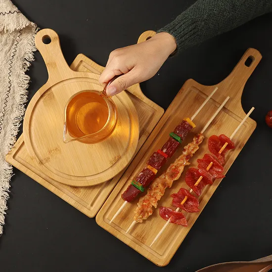 Tabla redonda sostenible de bambú para servir frutas, pan y queso con asa